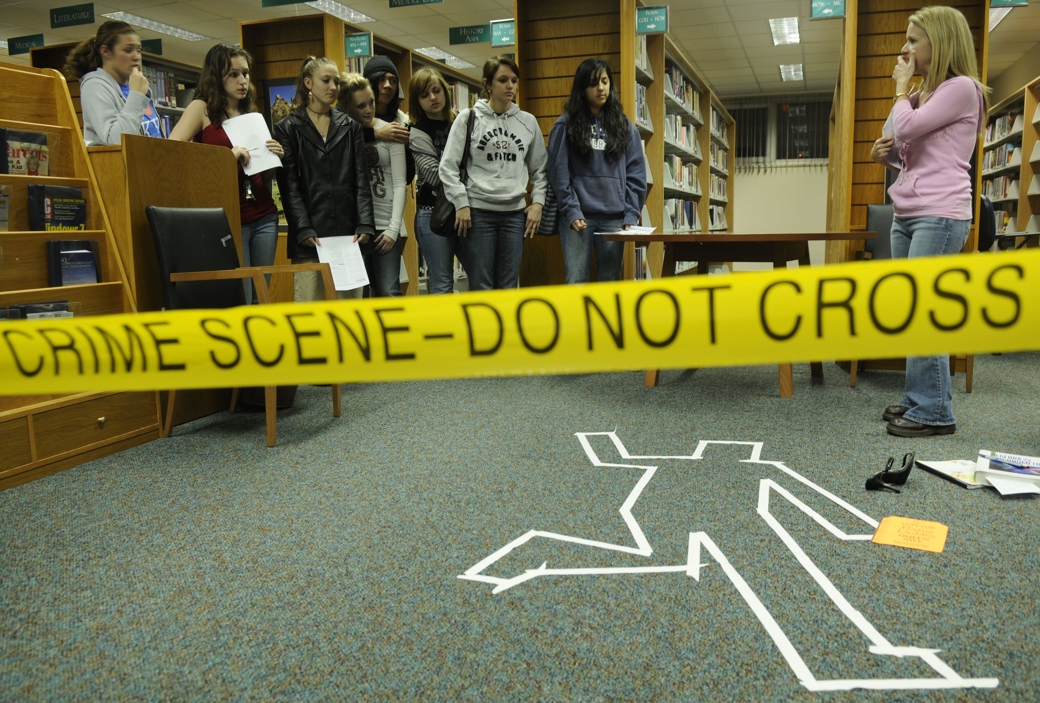 Group of people discussing a murder at a crime scene