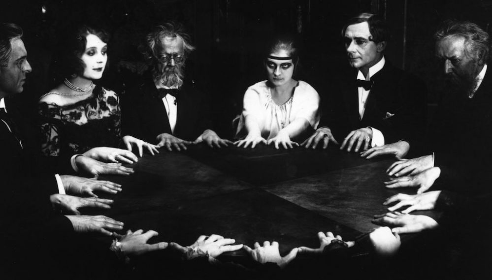 Group conducting a  seance